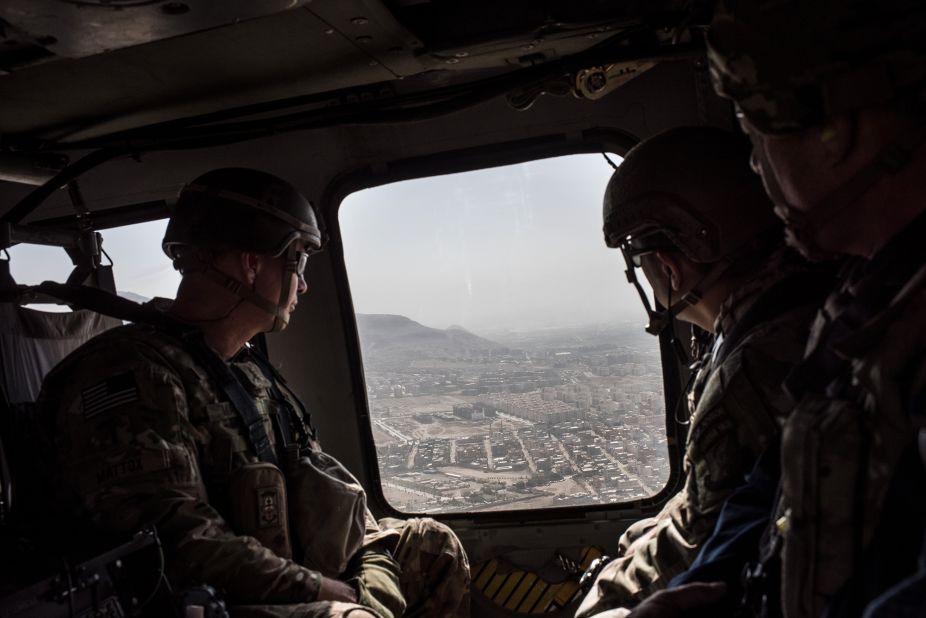 American service members ride in a helicopter on the way to the Bagram Air Base near Kabul in September 2017. President Donald Trump had recently announced a plan to increase troops in the country.
