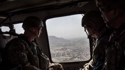 KABUL, AFGHANISTAN - SEPTEMBER 5: American service members deployed for Mission Resolute Support ride in a helicopter over Kabul on the way to Bagram Air Field on September 5, 2017 in Kabul, Afghanistan. Currently the United States has about 11,000 troops in the deployed in Afghanistan, with a reported 4,000 more expected to arrive in the coming weeks. Last month, President Donald Trump announced his plan for Afghanistan which called for an increase in troop numbers and a new conditions-based approach to the war, getting rid of a timetable for the withdrawal of American forces in the country. (Photo by Andrew Renneisen/Getty Images)