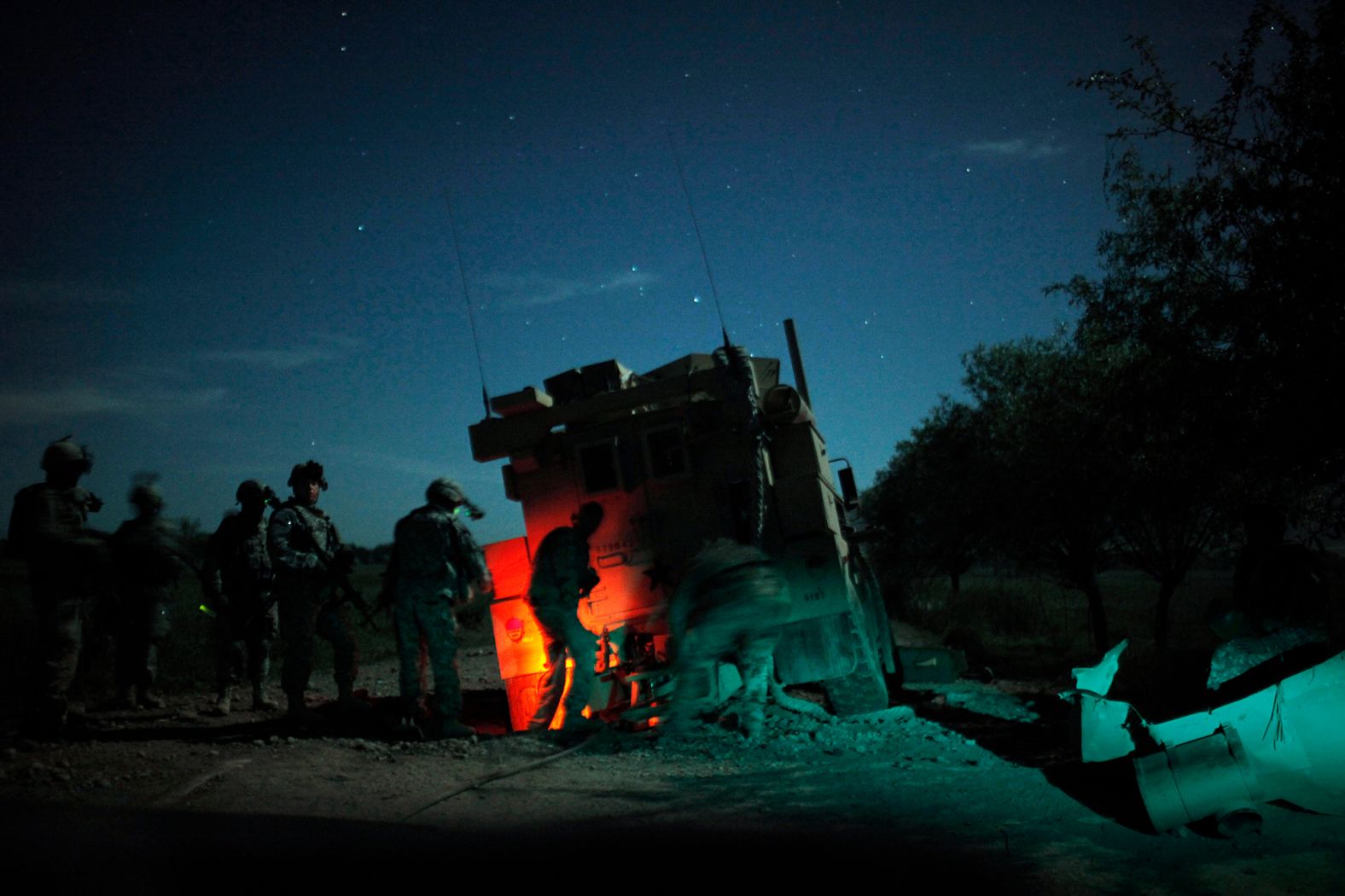 US soldiers recover an armored vehicle that was hit by an explosive device in Afghanistan's Kunduz province in April 2010.
