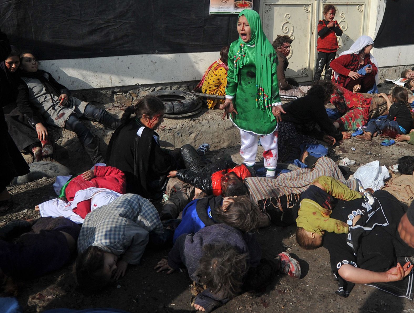 Tarana Akbari, 12, screams after a suicide bomber attacked the Abul Fazel Shrine in Kabul, Afghanistan, in December 2011. <a href="index.php?page=&url=https%3A%2F%2Fwww.cnn.com%2F2011%2F12%2F06%2Fworld%2Fasia%2Fafghanistan-violence-analysis%2Findex.html" target="_blank">Twin bomb blasts</a> killed dozens of Afghan people on the holy day of Ashura.