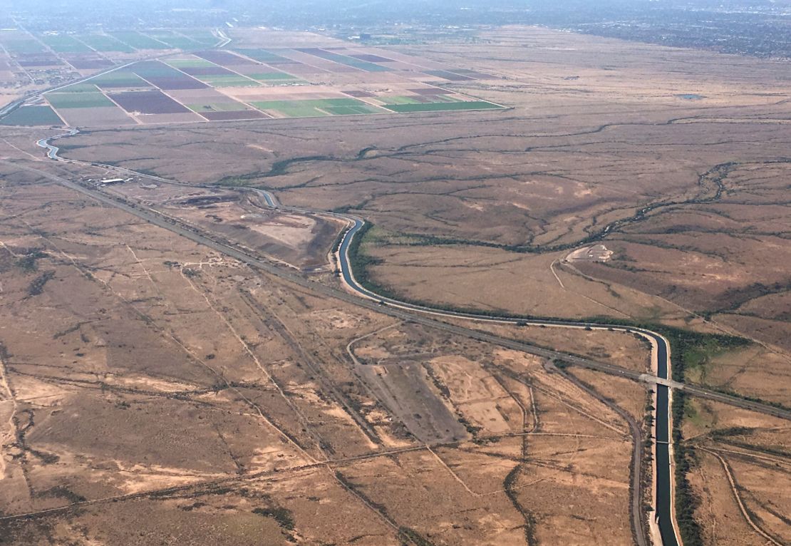 The Central Arizona Project canal runs through rural desert near Phoenix. Some farmers who receive Colorado River water from the Central Arizona Project could see their deliveries cut sharply as soon as next year.