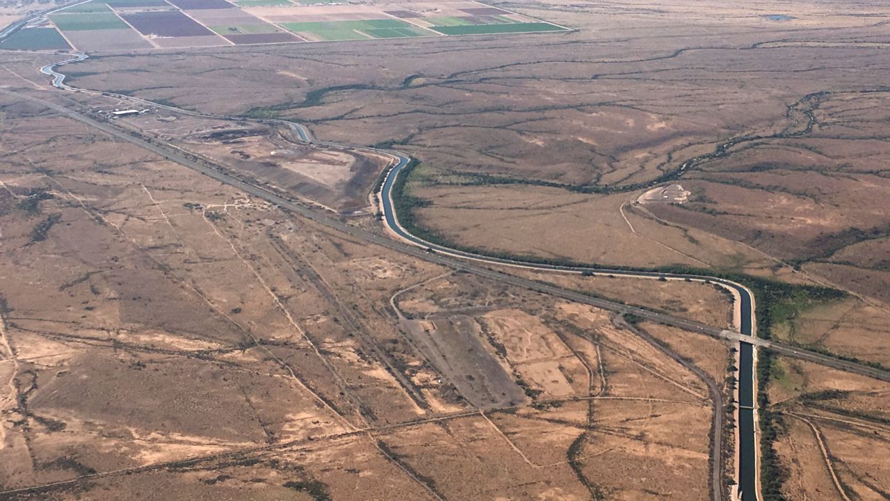 The Central Arizona Project canal runs through rural desert near Phoenix. Some farmers who receive Colorado River water from the Central Arizona Project could see their deliveries cut sharply as soon as next year.