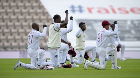 West Indies players take a knee in support of the Black Lives Matter movement ahead of play on the first day of the first Test cricket match against England.