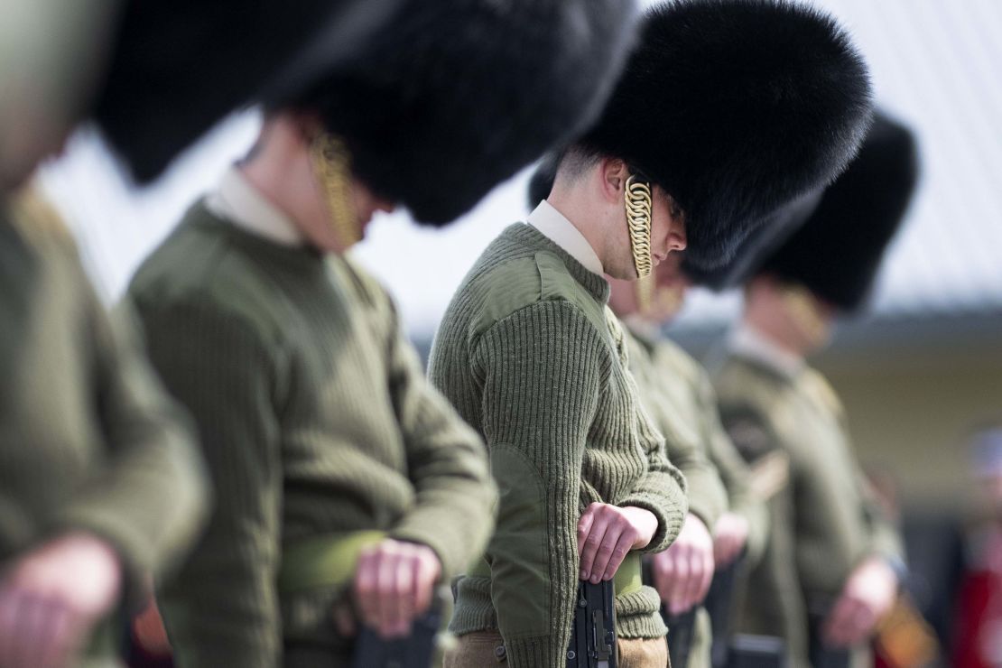 Soldiers from the Welsh Guards bow their heads as they rehearse for Philip's funeral.