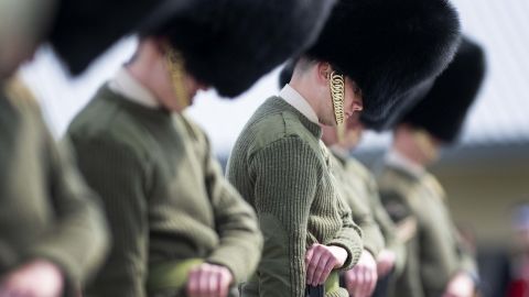 Soldiers from the Welsh Guards bow their heads as they rehearse for Prince Philip's funeral in Woking, England on Wednesday.