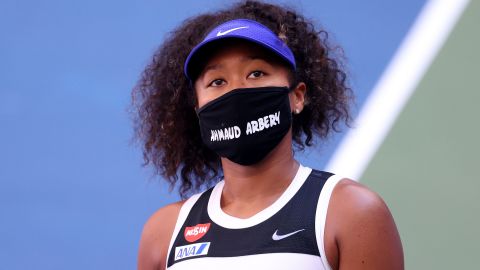 Before each match at the US Open 2020, Japanese tennis player Naomi Osaka wore a face covering displaying the name of a different Black victim of alleged police or racist violence in the US -- from Breonna Taylor in her first round-match against Misaki Doi to Tamir Rice in the final against Azarenka. Here Osaka displays the name Ahmaud Arbery, an unarmed 25-year-old Black man, shot while jogging in Georgia.