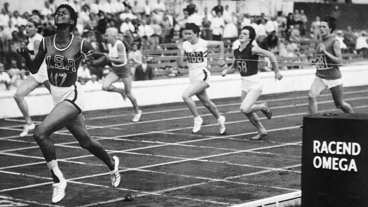 Wilma Rudolph, the sprinter who became an international star as the first American woman to win three gold medals in a single Olympics -- the 100m, 200m, and 4x100m relay at the 1960 Rome Games -- returned to the US a champion and used her new found platform to advocate for the integration of pools and parks in in her hometown of Clarksville, Tennessee. Rudolph is pictured crossing the finish line in a women's sprint event at the 1960 Rome Olympics.