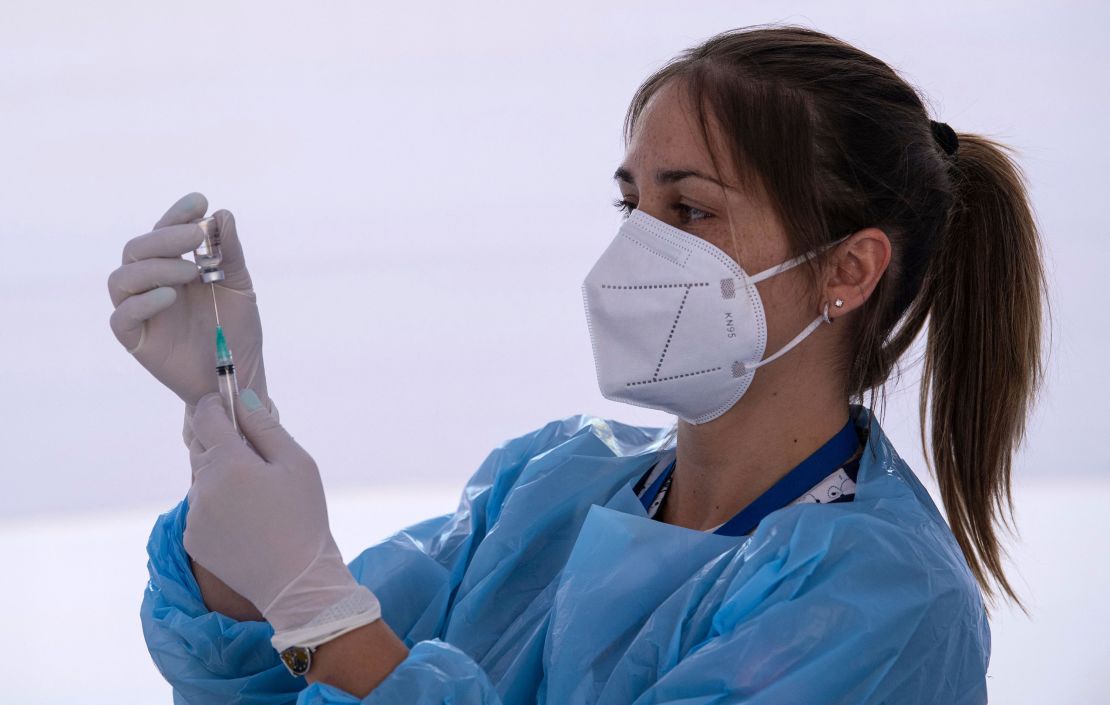 A health worker prepares a dose of the Chinese CoronaVac vaccine at a vaccination centre in Santiago.