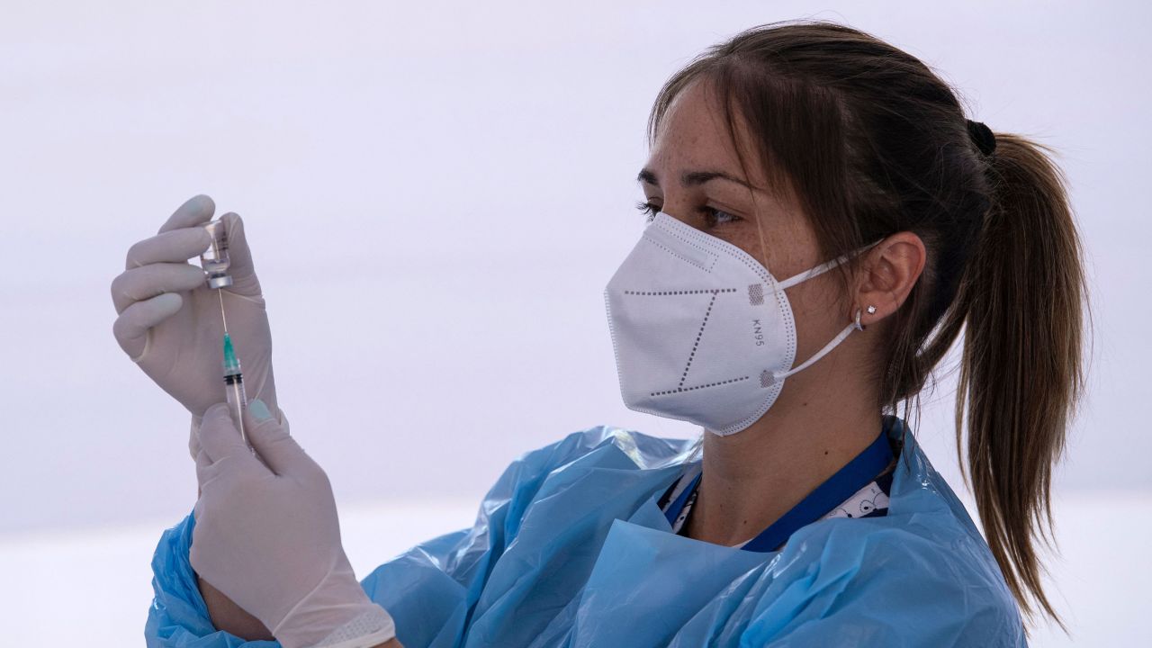 A health worker prepares a dose of the Chinese CoronaVac vaccine at a vaccination centre in Santiago.