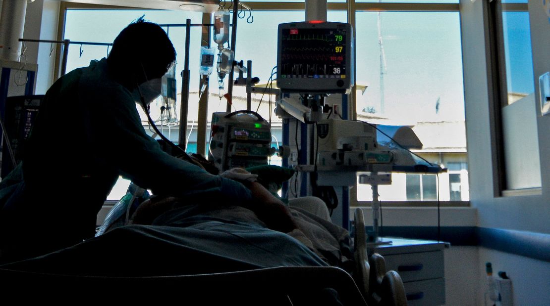 A nurse checks a Covid-19 patient at the Intensive Care Unit of the Guillermo Grant Benavente Hospital in Concepcion, Chile.