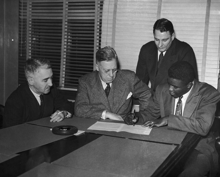 Robinson signs a contract with the Montreal Royals, a minor-league team and farm team of the Brooklyn Dodgers, in 1945.