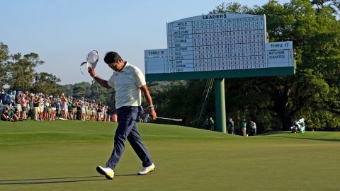 Matsuyama walks off the 18th green after winning the Masters.