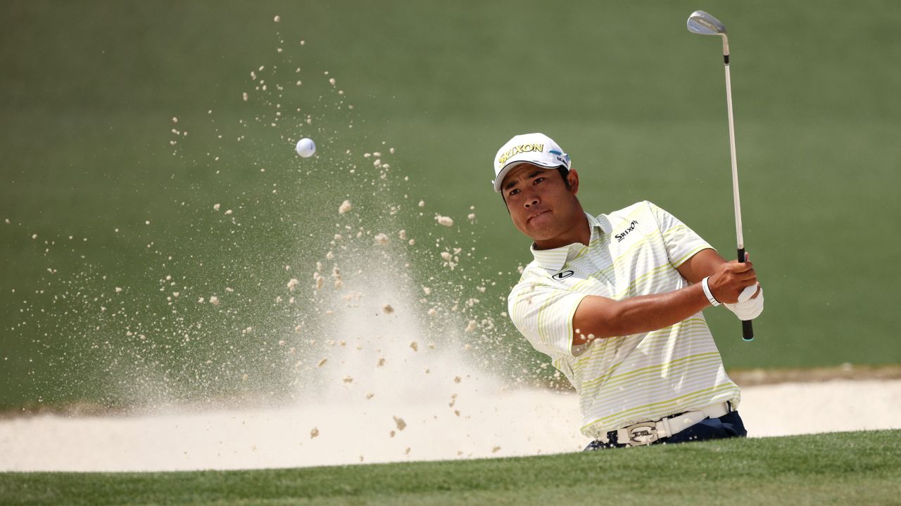 Matsuyama plays a shot from a bunker on the second hole during the final round of the Masters.