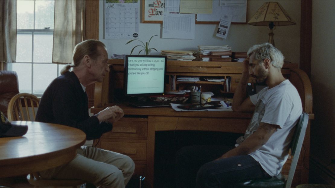 Paul Raci as Joe and Riz Ahmed as Ruben, and the transcription machine used for Ruben to communicate with Joe before he learns American Sign Language.