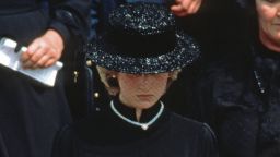 MONACO - SEPTEMBER 18: Diana, Princess of Wales, wearing a black dress and black boater hat with a netted veil and a heart shaped diamond necklace which was a gift from Prince Charles, Prince of Wales to mark the birth of Prince William,  attends the funeral of Princess Grace of Monaco on September 18, 1982 in Monaco. (Photo by Anwar Hussein/Getty Images)