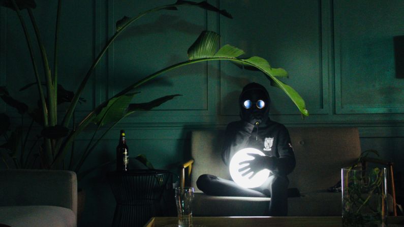 The anonymous South African visual artist known as Xopher Wallace -- shown here in his signature morphsuit, goggles and sweatshirt -- aims to inspire people to live their dreams while awake, through his "Sleepwalker" series.