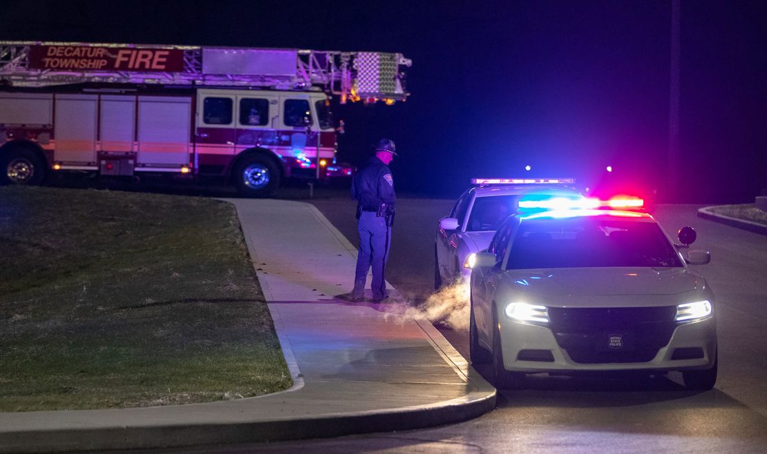 An officer stands outside the FedEx facility in Indianapolis.