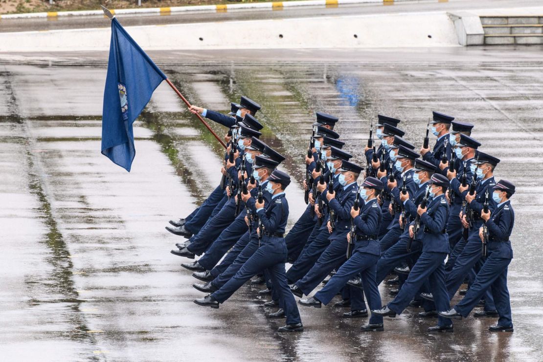 Police officers perform a new goose-stepping march, the same style used by police and troops on the Chinese mainland, at the city's police college during an open day to mark the National Security Education Day in Hong Kong on April 15, 2021.