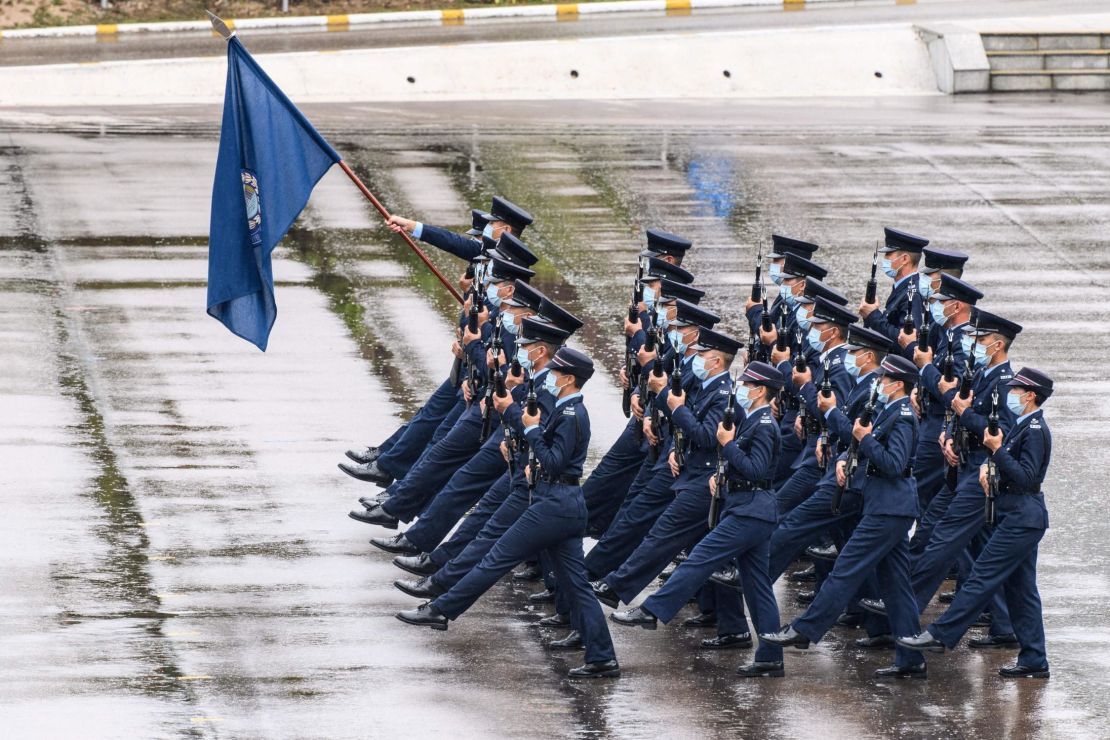 Hong Kong police officers perform a new goose-stepping march, the same style used by the Chinese military, to mark the National Security Education Day in Hong Kong on April 15, 2021.