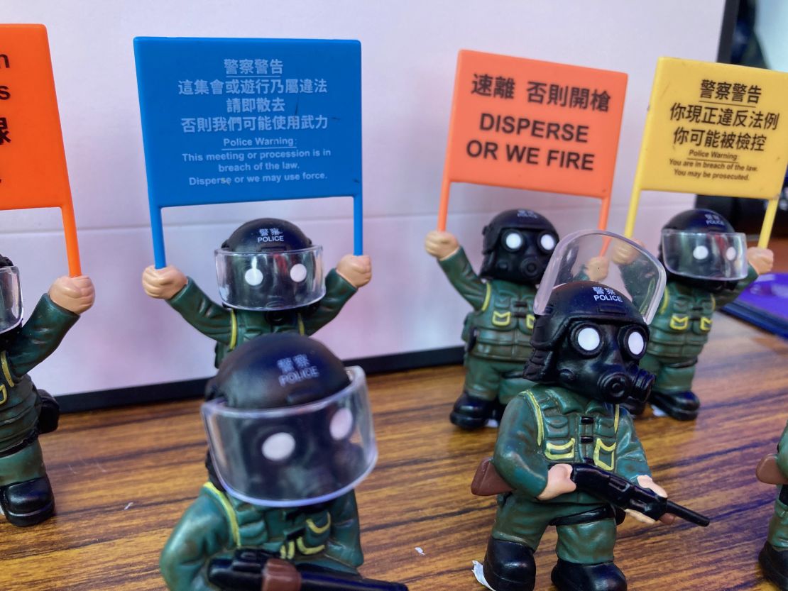 Visitors pose with a police mascot at the city's police college during an open day to celebrate the National Security Education Day in Hong Kong on April 15, 2021.