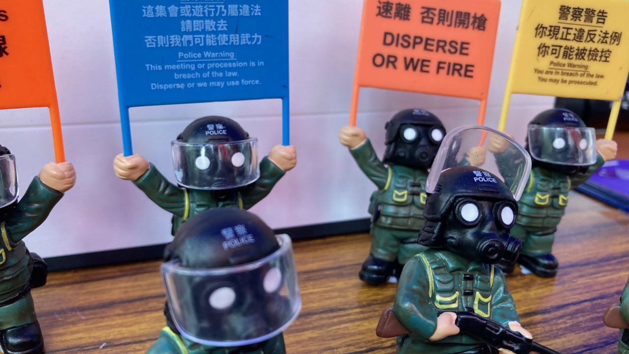 Visitors pose with a police mascot at the city's police college during an open day to celebrate the National Security Education Day in Hong Kong on April 15, 2021.
