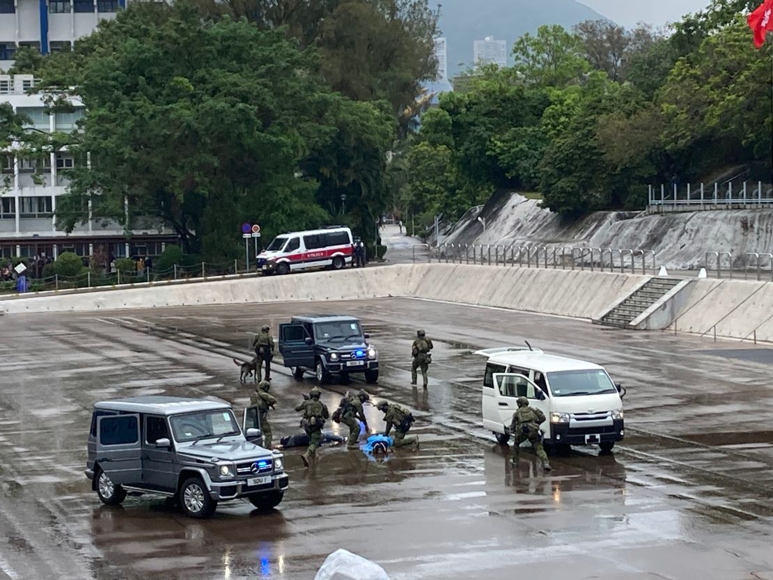 Hong Kong police capture "terrorists" during a demonstration at National Security Education Day at the Hong Kong Police College on April 15, 2021.