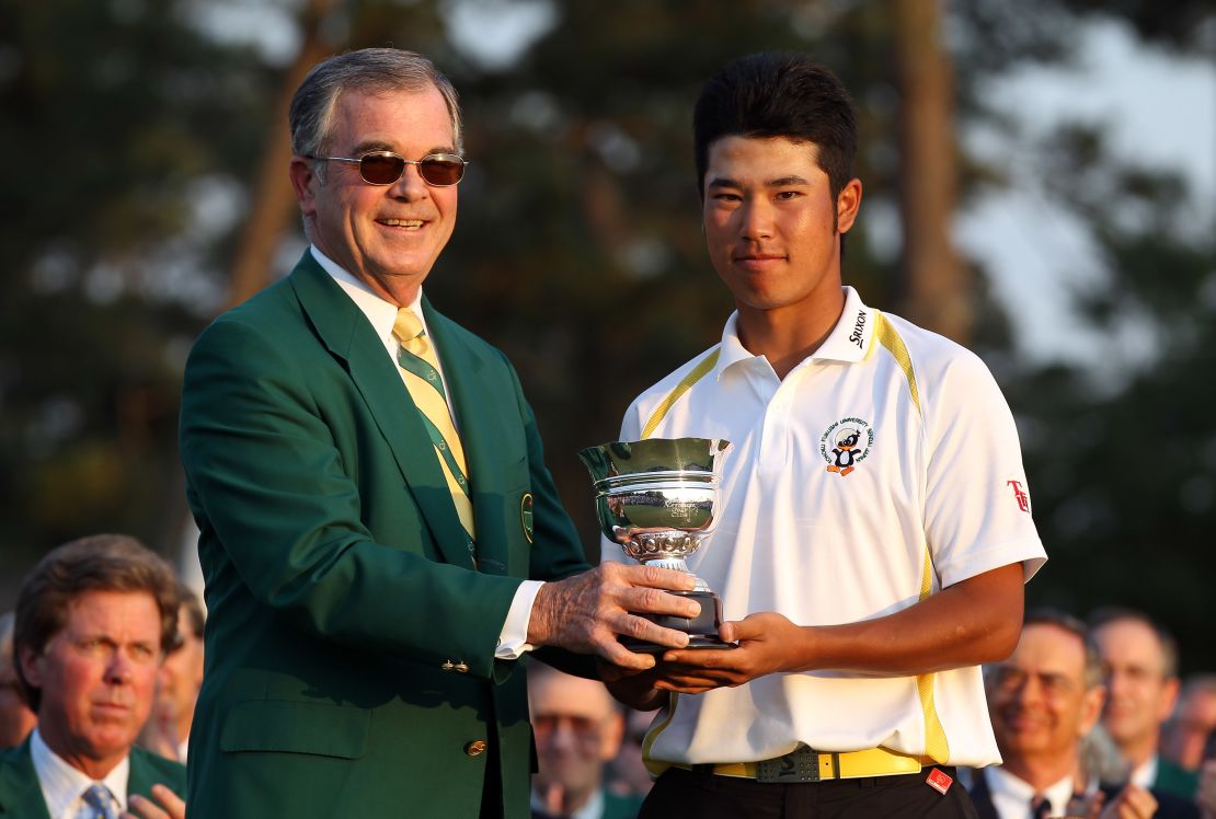 Matsuyama with the trophy for the low amateur after the final round of the 2011 Masters.