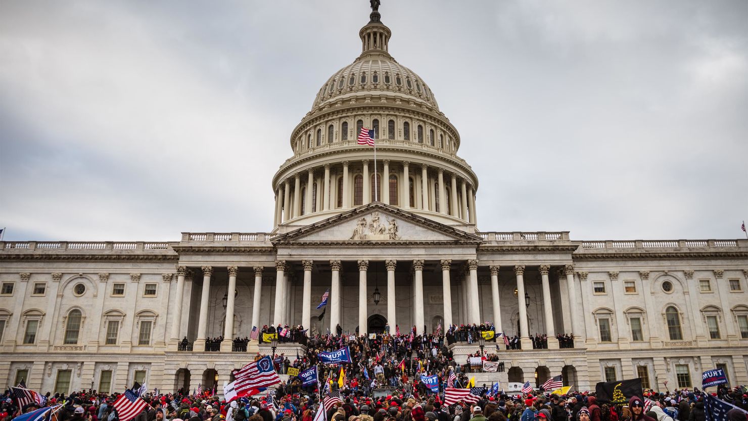 A large group of pro-Trump protesters stand on the East steps of the US Capitol after storming its grounds on January 6, 2021, in Washington, DC. 