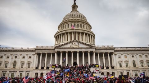 A large group of pro-Trump protesters stand on the East steps of the Capitol Building after storming its grounds on January 6, 2021 in Washington, DC. 