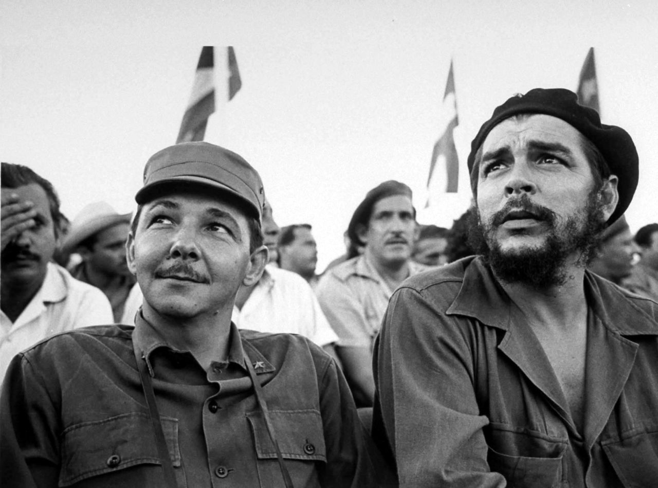 Castro sits next to Cuban revolutionary Che Guevara during a 1964 celebration of the July 26th revolution.