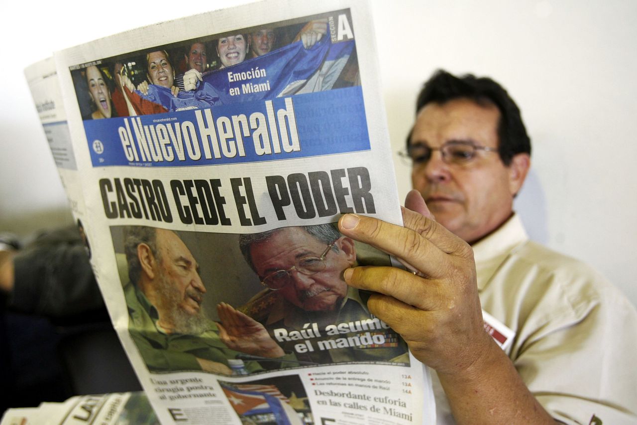 A man in Miami reads the Miami Herald's Spanish-language edition, El Nuevo Herald, with news of Fidel Castro handing over power to Raul Castro in 2006. Castro was undergoing intestinal surgery and provisionally handed over power to his brother. 