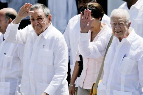 Castro and former U.S. President Jimmy Carter wave as Carter departs from Havana in 2011. Carter, who traveled with his wife Rosalynn, met with Raul and Fidel Castro as well as with US contractor Alan Gross, who was imprisoned in Cuba at the time. Carter had visited Cuba previously in 2002.