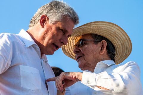 Castro talks with First Vice President of Cuba Miguel Díaz-Canel while watching a May Day parade in Revolution Square in Havana in 2016.
