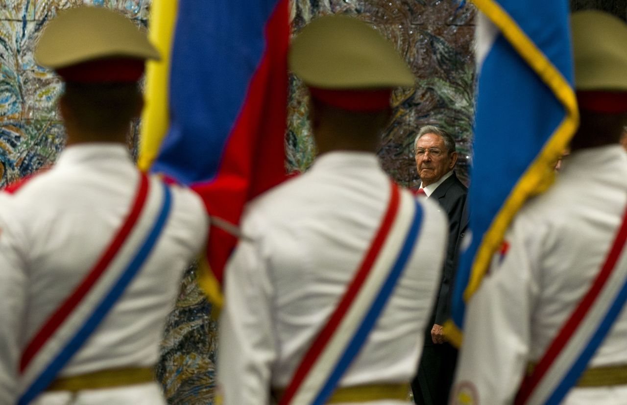 Castro looks at the honor guard before granting Ecuador's President Rafael Correa with the José Martí Order in Havana in 2017.