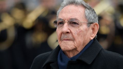 Cuba's president Raul Castro observes a welcoming ceremony at the Arc de Triomphe in Paris in 2016.
