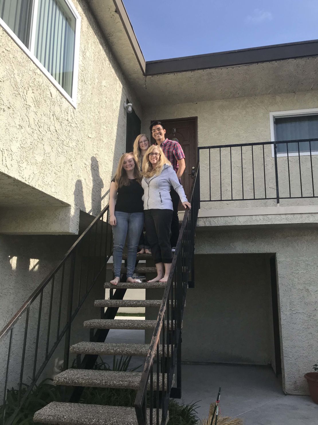 Shanan Cale, bottom right, pictured with her pod, including daughters Natalie Cale, 19, bottom left, Madeleine Cale, 23, top left, and Madeleine's boyfriend, Matt Sigala, 23.