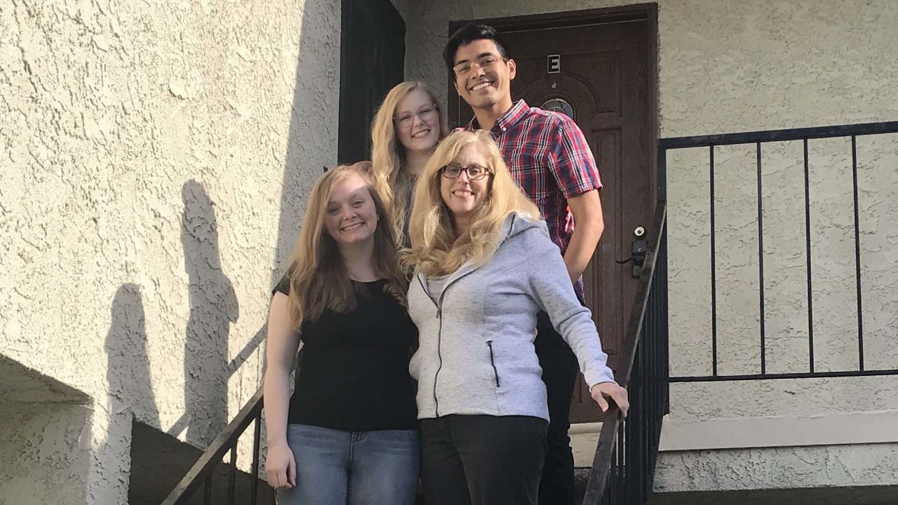 Shanan Cale, bottom right, pictured with her pod, including daughters Natalie Cale, 19, bottom left, Madeleine Cale, 23, top left, and Madeleine's boyfriend, Matt Sigala, 23.