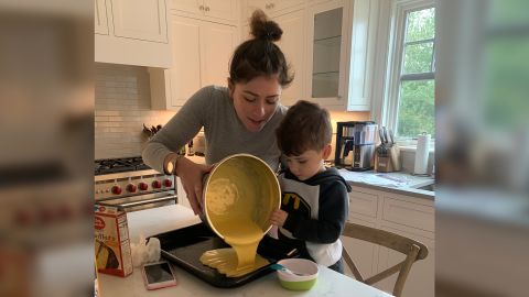 Melas enjoys baking time with her son.