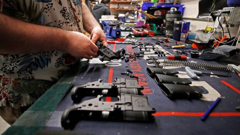 A worker assembles AR-15 style rifles at Davidson Defense in Orem, Utah on February 4, 2021. - Gun merchants sold more than 2 million firearms in January, a 75% increase over the estimated 1.2 million guns sold in January 2020, according to the National Shooting Sports Federation, a firearms industry trade group.
The FBI said it conducted a record 4.3 million 