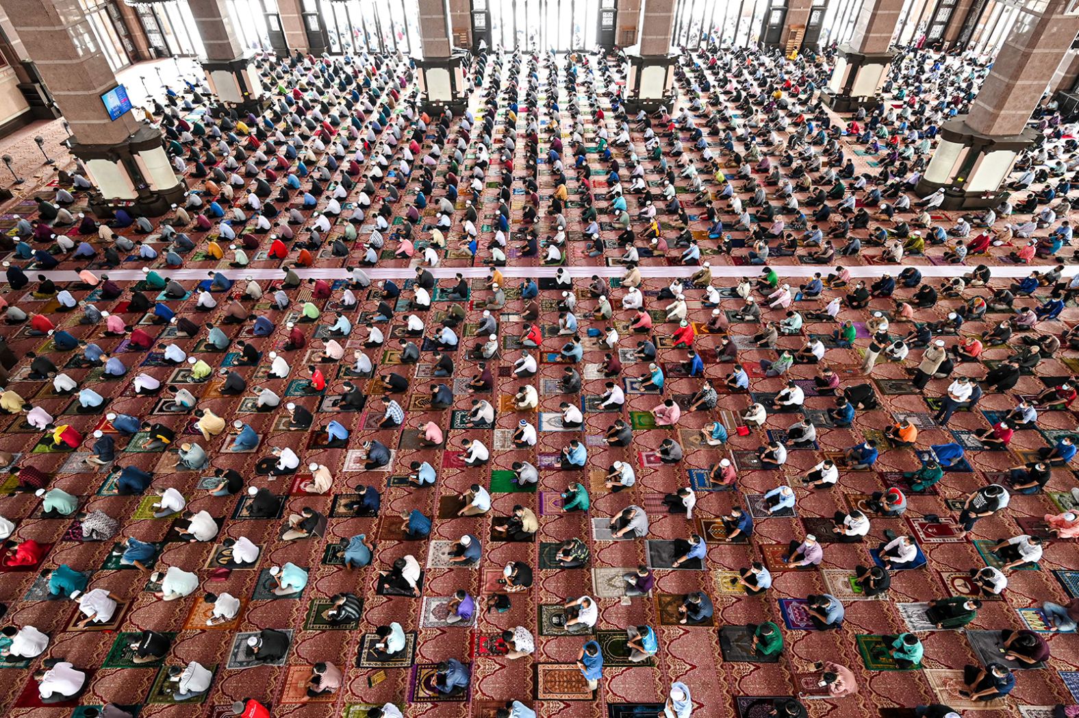 People practice social distancing at the Putra Mosque in Putrajaya, Malaysia, on April 16.