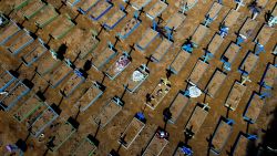 TOPSHOT - Aerial view of graves of COVID-19 victims at the Nossa Senhora Aparecida cemetery in Manaus, Amazon state, Brazil, on April 15, 2021. - Covid-19 has claimed more than 3,000 lives per day on average in Brazil over the past week, the most by far worldwide. The country of 212 million people has a total death toll of more than 360,000, second only to the United States. (Photo by Michael DANTAS / AFP) (Photo by MICHAEL DANTAS/AFP via Getty Images)