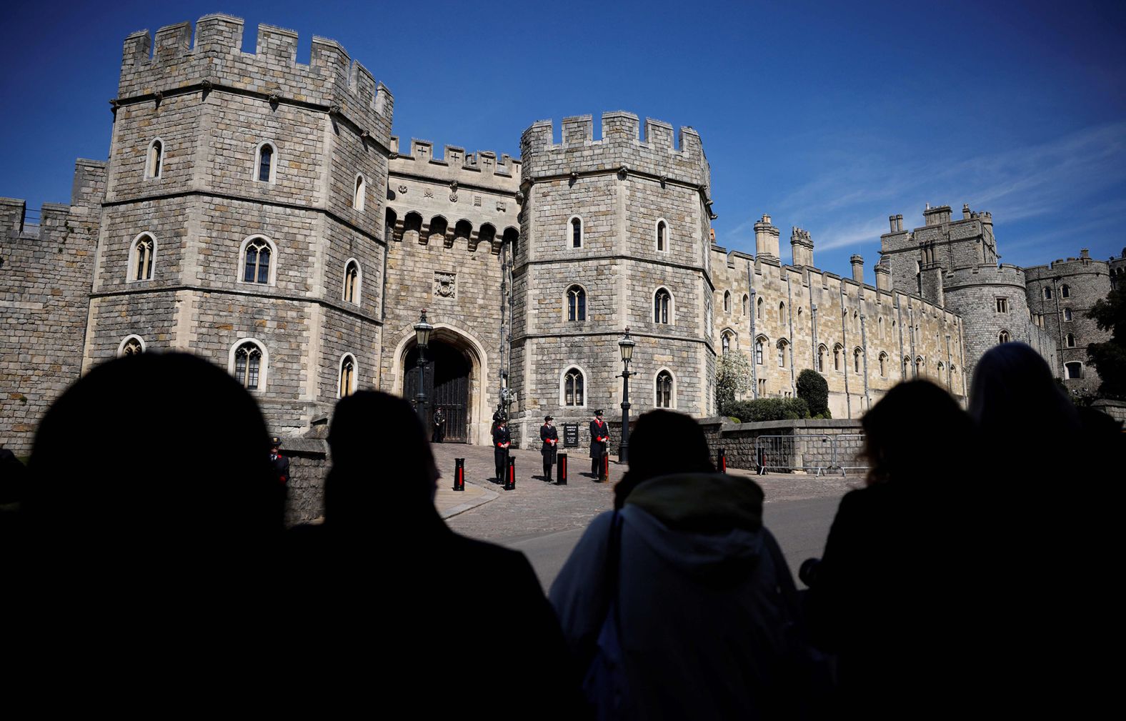 People gather outside Windsor Castle before the funeral.