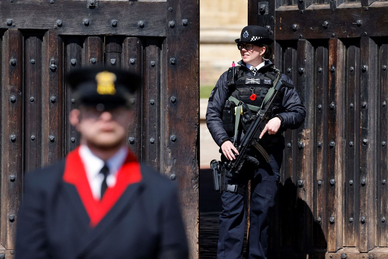 A police officer stands guard at Windsor Castle before the funeral.