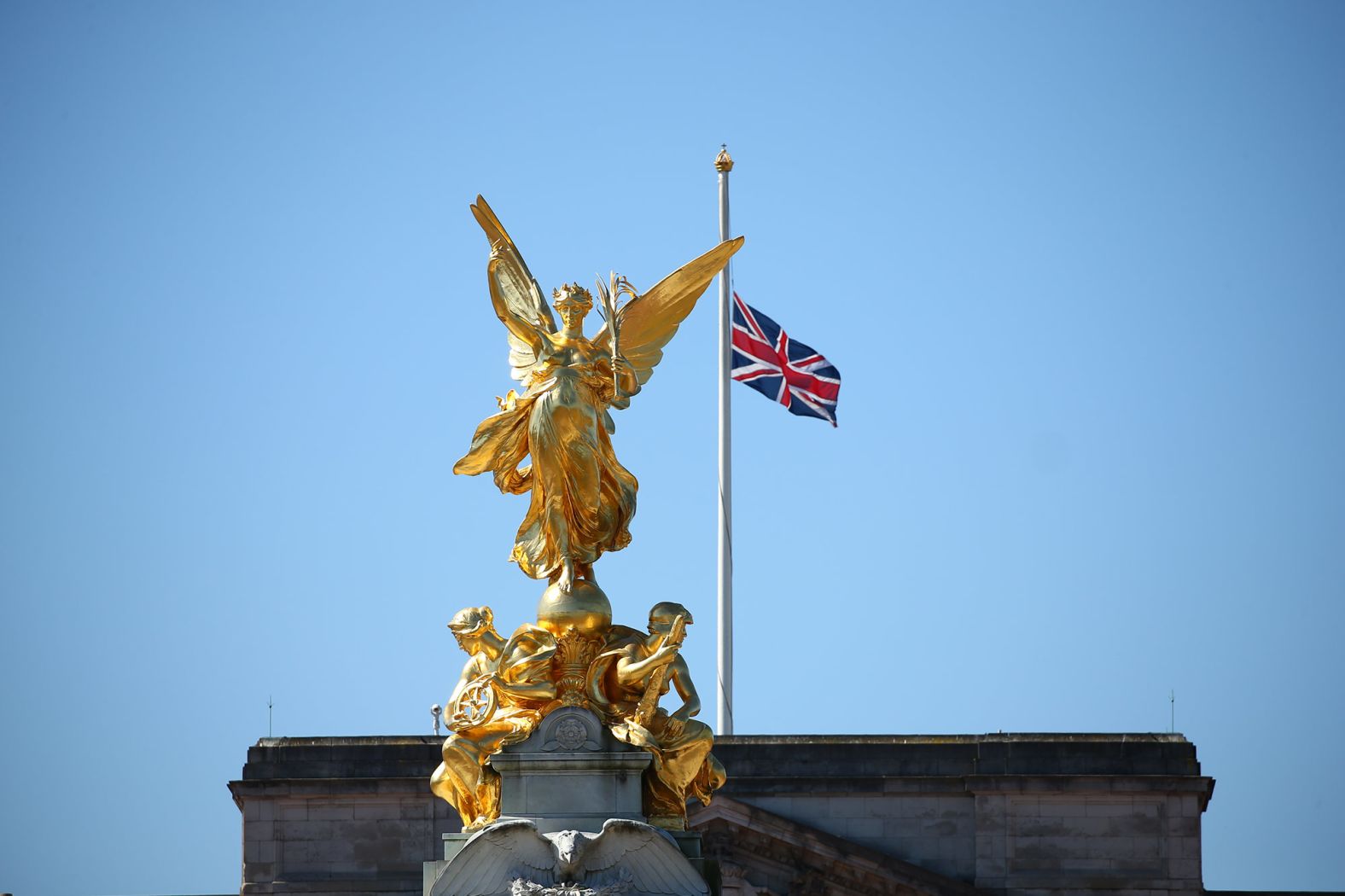 A flag flies at half-staff over Buckingham Palace on Saturday.