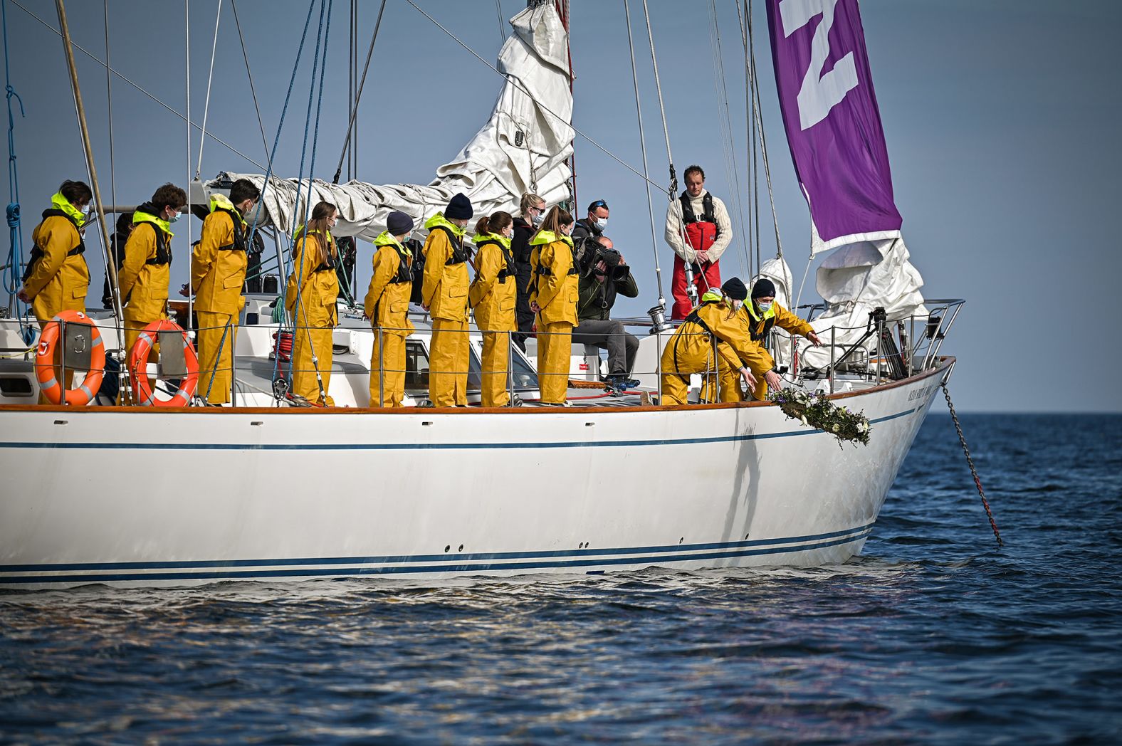 Young sailors from Prince Philip's former school Gordonstoun lay a wreath in the Moray Firth, off the coast of Hopeman Harbour. Hopeman Harbour is where Philip learned to sail.