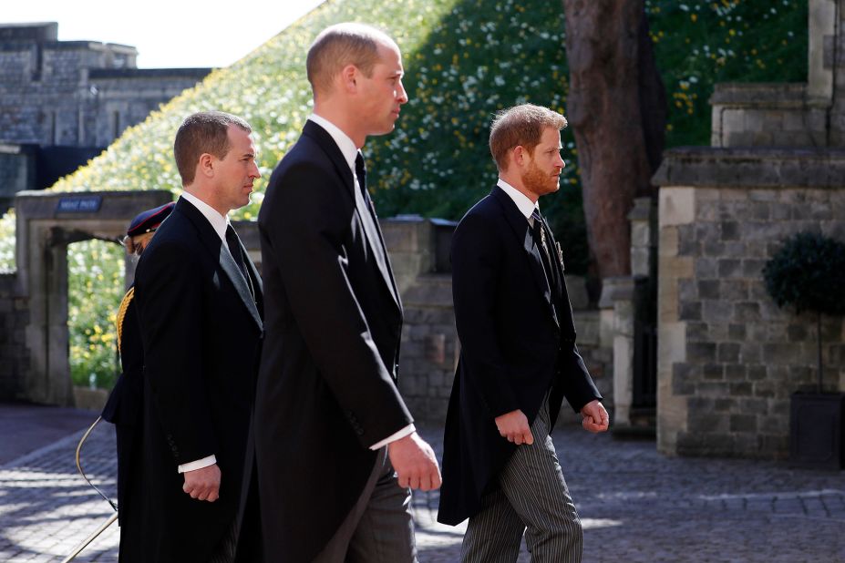 From left, Philip's grandsons Peter Phillips, Prince William and Prince Harry take part in the funeral procession.