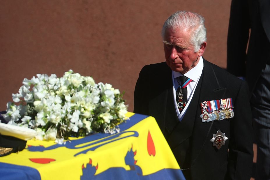 Prince Charles walks behind his father's coffin during the procession.