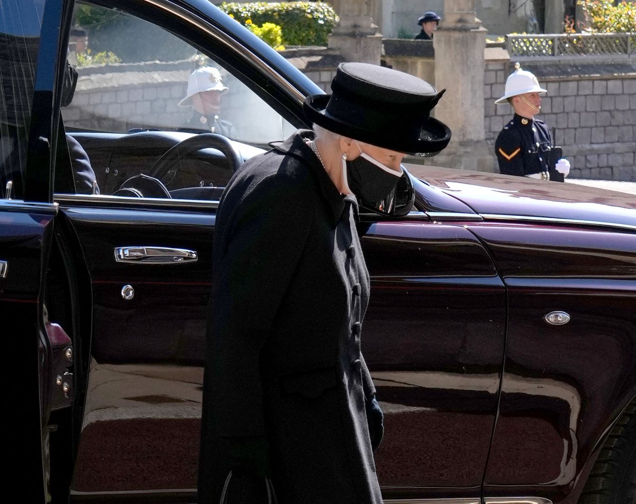 The Queen arrives at St. George's Chapel.