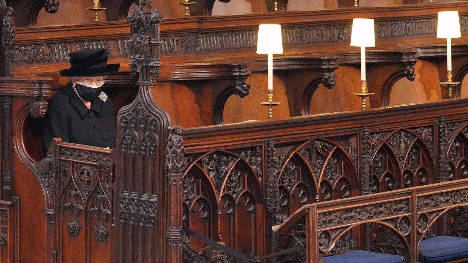 The Queen takes her seat alone at <a href="http://www.cnn.com/2021/04/17/uk/gallery/prince-philip-funeral/index.html" target="_blank">Prince Philip's funeral</a> in April 2021. The ceremony was limited to 30 people, in line with England's coronavirus restrictions.