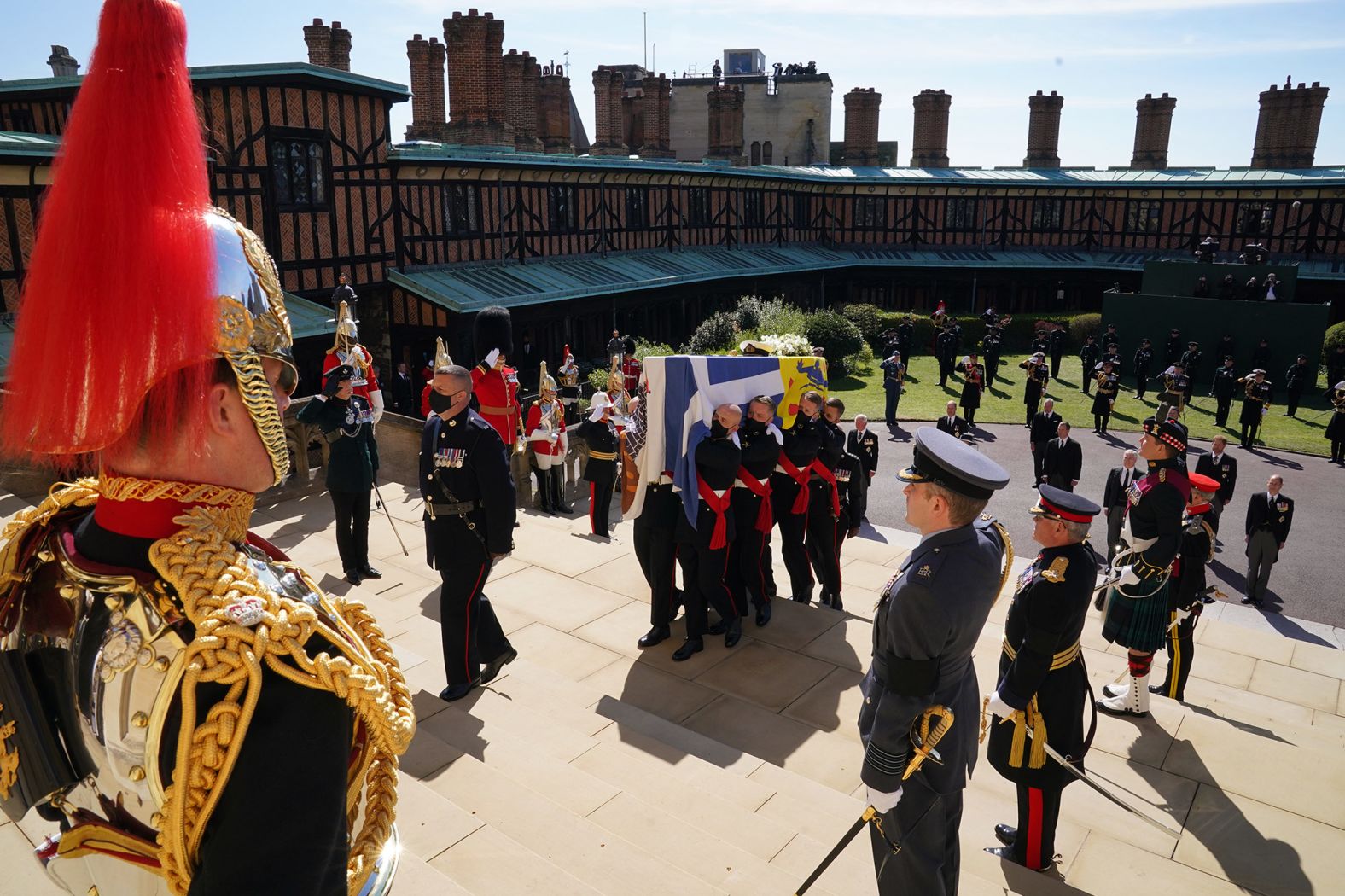 Philip's coffin is carried up the steps of the chapel.